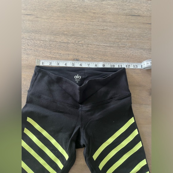 ALO YOGA Cropped Black Workout Leggings with Yellow Stripes - Picture 5 of 5
